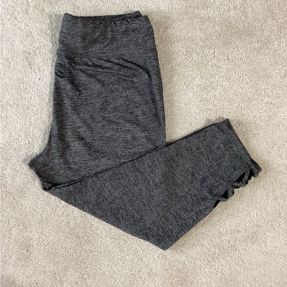 Gray capris stretch pants with detail at the bottom.
